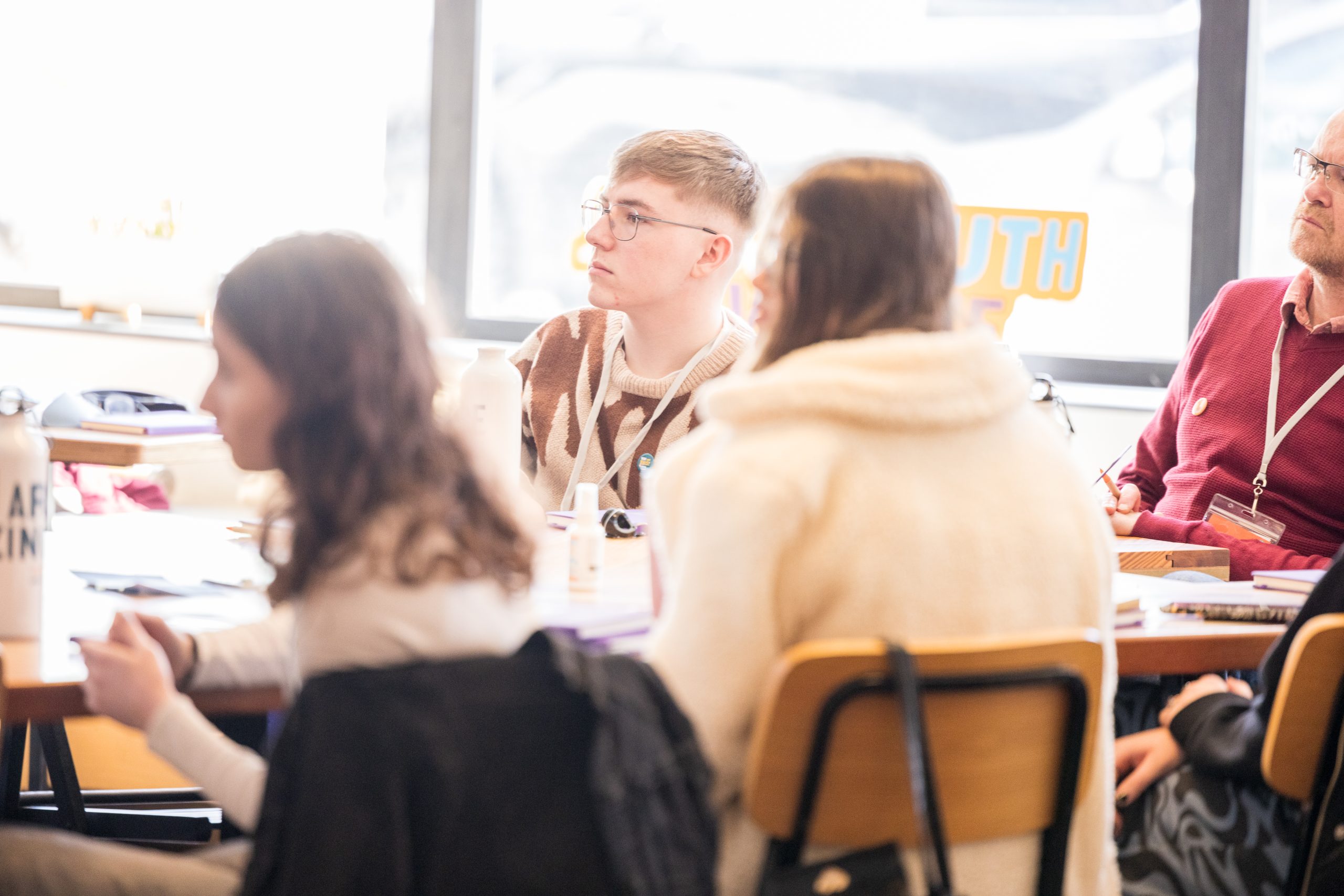 Venetia Quick in pink running jacket standing with her arms crossed
