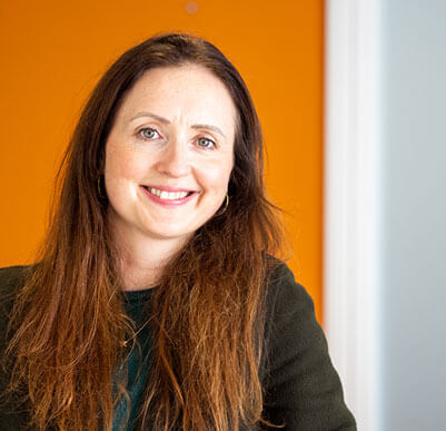 clinician headshot smiling at the camera