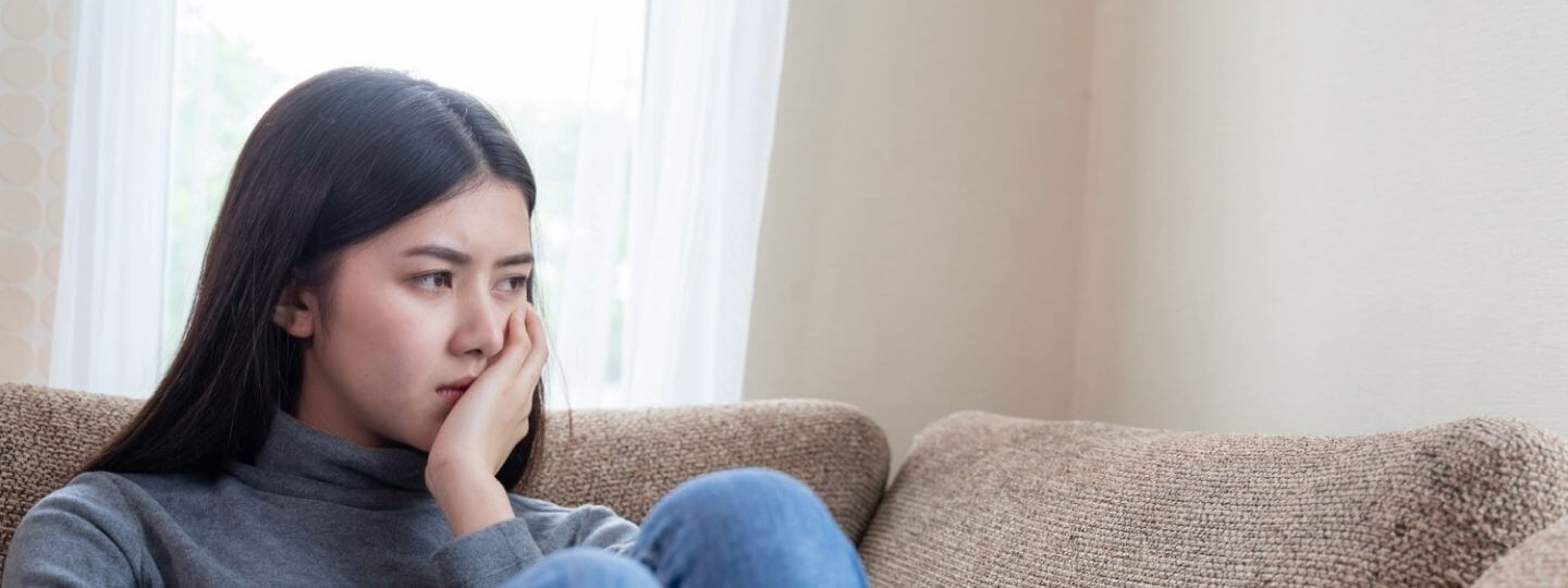 A girl looking into a mirror, blurry reflection