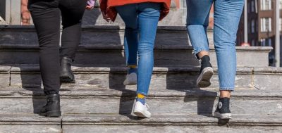 Image of 3 people walking up steps