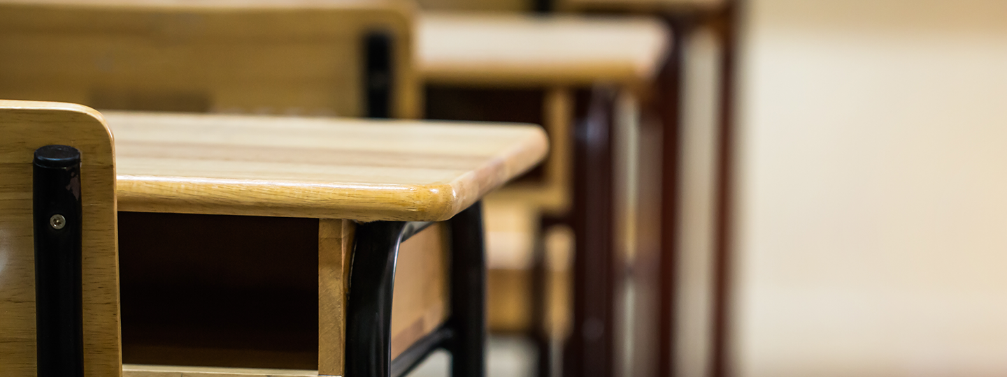 teenager girl looking sad in classroom