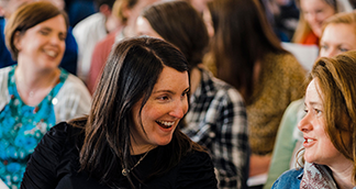 clinicians laughing at a workshop
