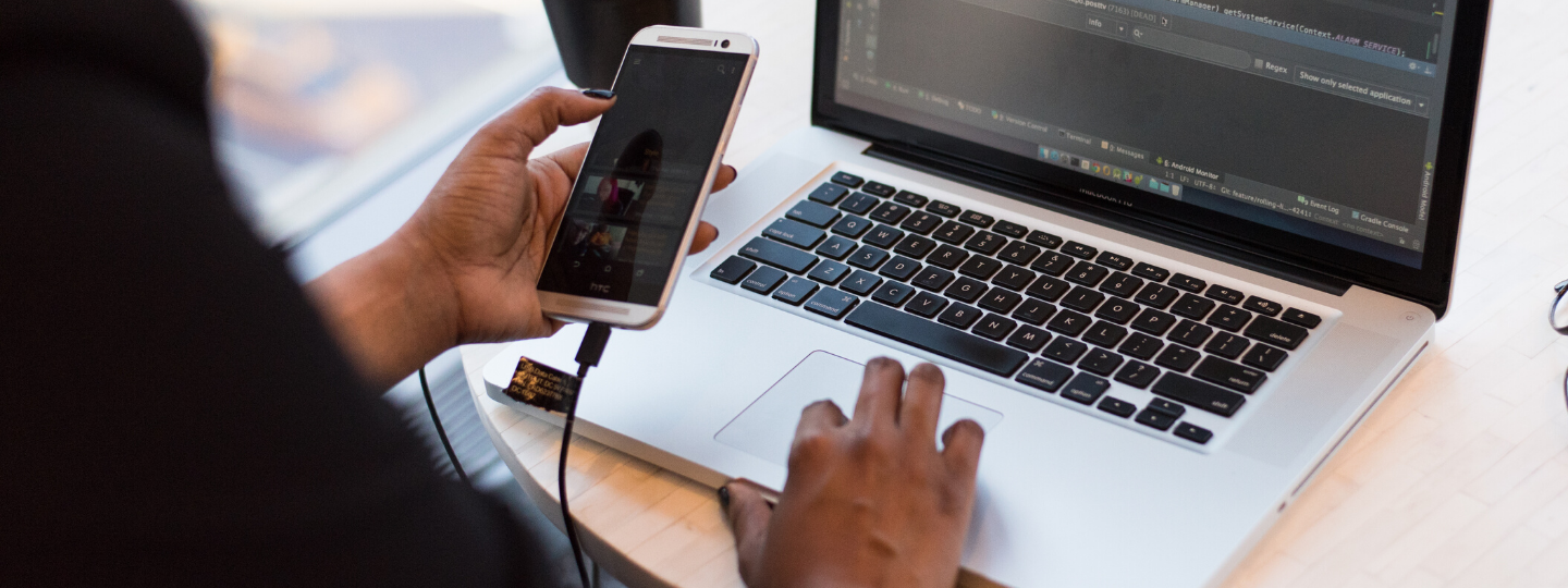 A person drawing multiple elements of a phone application