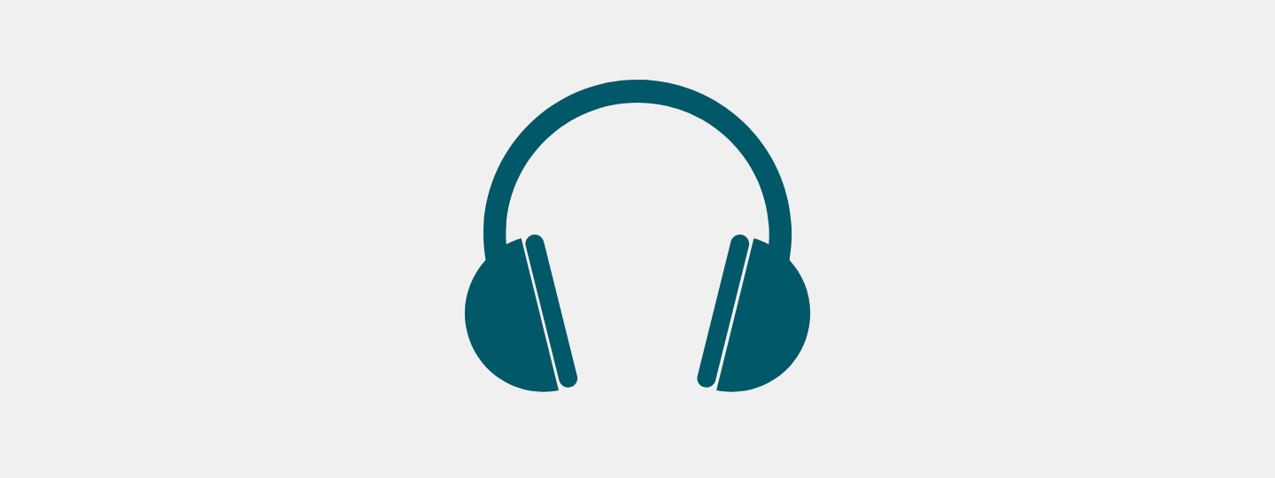 close up of hands resting on clipboard on lap holding notepaper