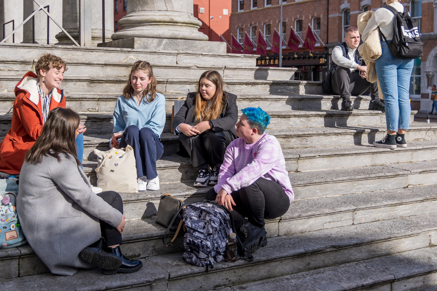 young people on steps outside