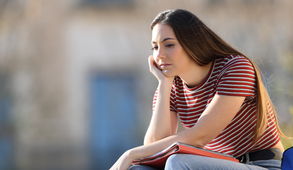 young woman with chin in hand (1)